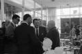 Photograph: [Nelson A. Rockefeller speaking to multiple individuals]