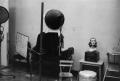 Thumbnail image of item number 1 in: '[Photograph of a room with photography equipment and a mannequin head]'.