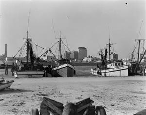 Primary view of object titled '[Photograph of four boats docked]'.