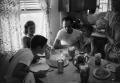 Photograph: [Photograph of the Williams family at a table]