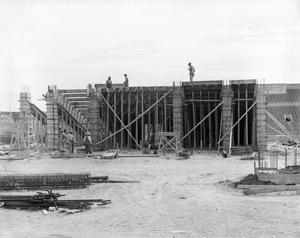 Primary view of object titled '[Photograph of construction workers building the Amon G. Carter Stadium]'.