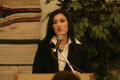 Photograph: [Young woman speaking at 2004 La Raza event 1]