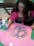 Photograph: [Woman making peace sign shirt from Clothesline Project]