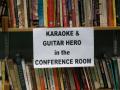 Photograph: [Karaoke sign on bookshelf]