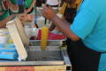 Primary view of [Elote being made at carnaval]