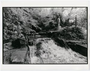 Primary view of object titled '[Jack Daniel's Distillery Cave Spring with Statue]'.