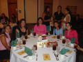 Photograph: [Guests around table at 2005 Celebración]