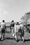 Photograph: [Cast and crew members walking]