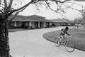 Photograph: [Dion Pride riding his bicycle, 2]