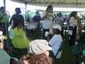 Photograph: [People under tent at 2004 Homecoming]