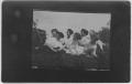 Photograph: [Seven women lounging in the grass]