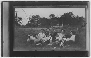 Primary view of object titled '[Eight women lounging in the grass together]'.