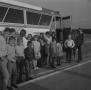 Photograph: [John DeLorean, Kelly and children with a bus, 3]