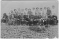Photograph: [A large group of students with their teacher]