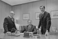 Photograph: [John DeLorean, Ed Cole and another man in an office, 6]