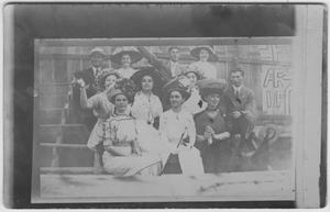 Primary view of object titled '[Eleven people seated together]'.