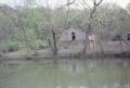 Photograph: [A shed near a pond]