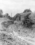 Photograph: [A trench next to a house]
