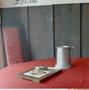 Photograph: [A red table and a beer stein]