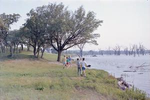 Primary view of object titled '[Doris, Pam, Carol, Byrd IV at the lake]'.