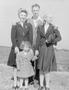 Photograph: [A man, two women and a little girl]