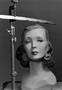 Photograph: [A mannequin head and a ruler]