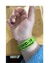 Photograph: [Julia Muegge's hand with hospital bracelet]