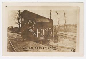 Primary view of object titled '[Photograph of two solders standing by a shack]'.