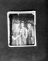 Photograph: [Print photo of two women and a man in formal attire]