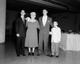 Photograph: [Two young men, a little boy and an older woman]