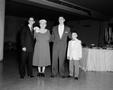 Photograph: [Two young men, a little boy and an older woman, 2]