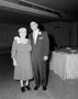 Photograph: [Man and woman in formal attire, posing together]
