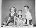 Photograph: [Three children sitting next to one another]