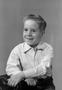 Photograph: [Boy in a collared shirt, smiling]