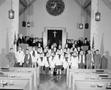 Photograph: [Group of children and adults in a church, 2]