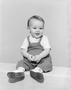 Photograph: [Toddler boy in overalls, boots and a short-sleeve shirt, 4]