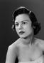 Photograph: [Woman in a strapless top, with a blank expression on her face, 2]