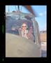 Primary view of [Iranian officials sitting in a Huey helicopter]
