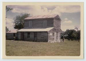 Primary view of object titled '[A log cabin in Grimes county]'.