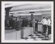 Thumbnail image of item number 1 in: '[A crowd of people standing and talking around office desks]'.