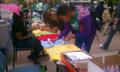 Photograph: [Students painting shirts for Clothesline Project]