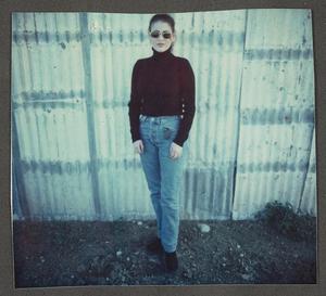 Primary view of object titled '[Woman in jeans and a black turtleneck]'.
