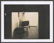 Photograph: [Chair with a camera bag resting on it and a tripod in the background]