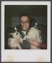 Photograph: [Byrd Williams IV holding two dogs]