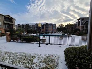 Primary view of object titled '[Apartment complex pool in snow]'.