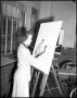 Photograph: [Dora Katherine Adams painting on easel at North Texas State Teachers…