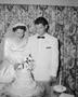 Photograph: [Newlyweds Glenella and Robert (Bob) Scarborough cutting their weddin…