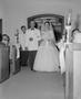 Photograph: [A bride, Glenella Scarborough, walking down the aisle]