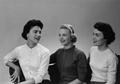 Photograph: [Three women conversing during portrait session, 2]