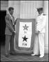 Thumbnail image of item number 1 in: '[Two Men Holding a Flag, 1942]'.